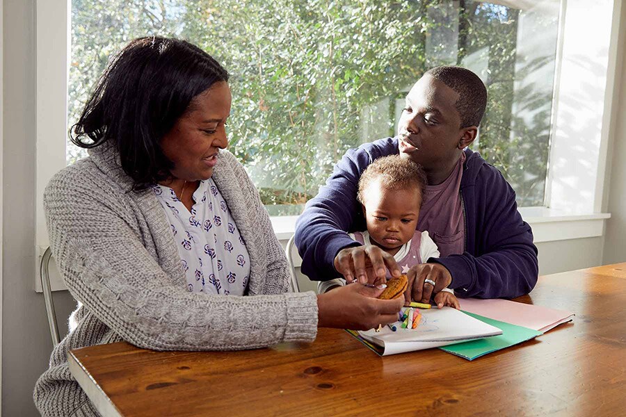 Father seems to disapprove of grandma offering his child a sweet treat