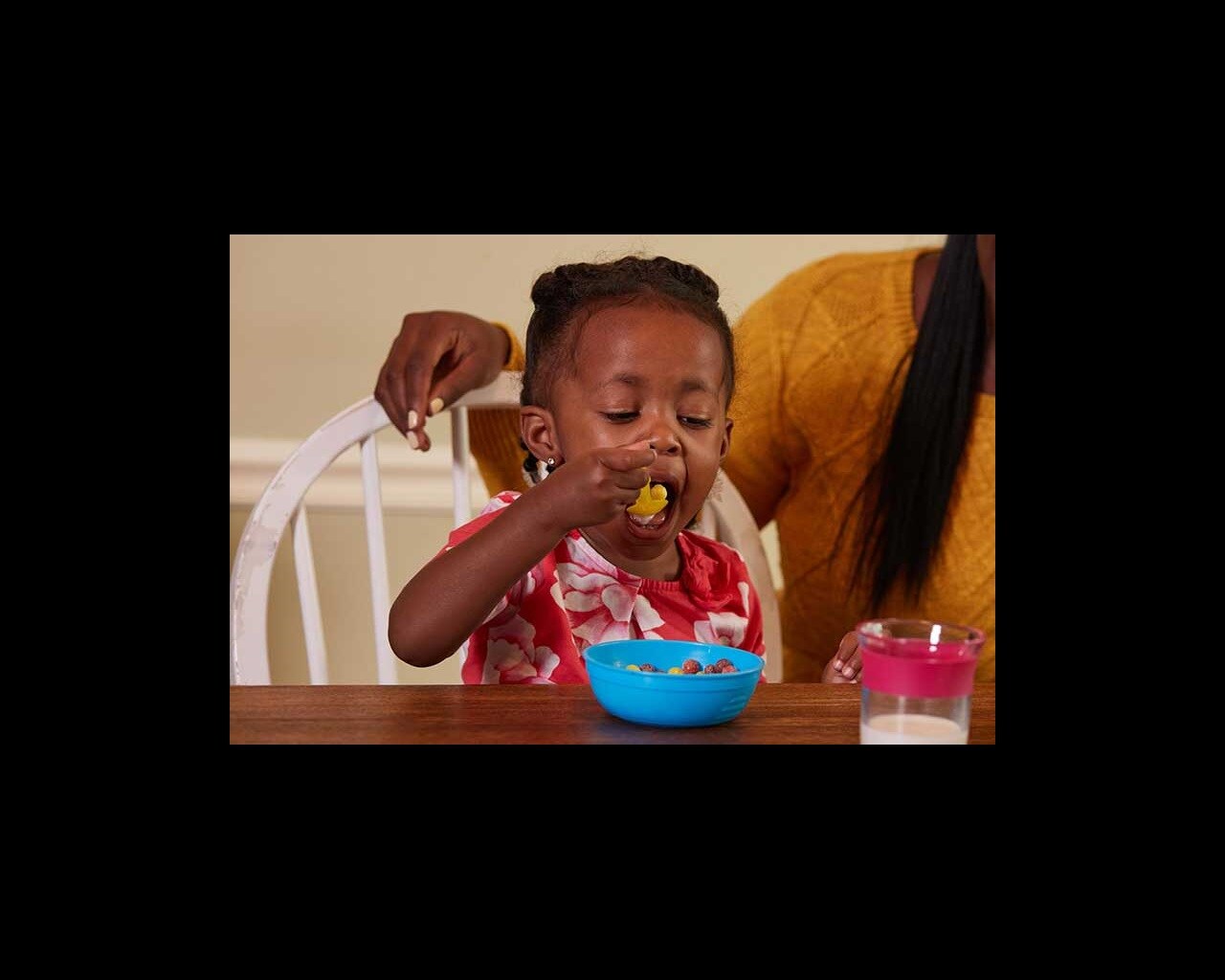 toddler eating sugary cereal