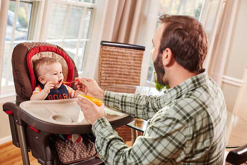 Dad feeding 5-month old