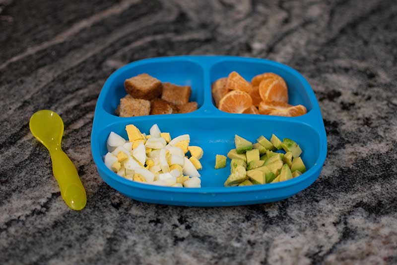 Toddler breakfast with avocado and hard-boiled egg
