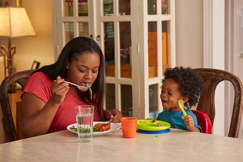 toddler watching mom eat