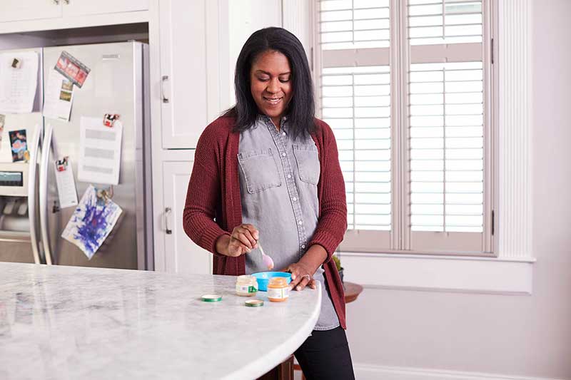 Mom making baby food