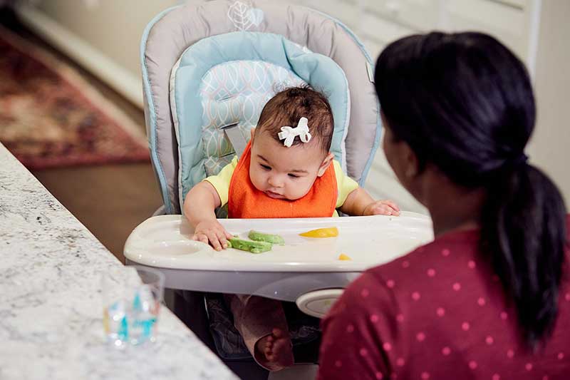 5 month old reaching for avocado