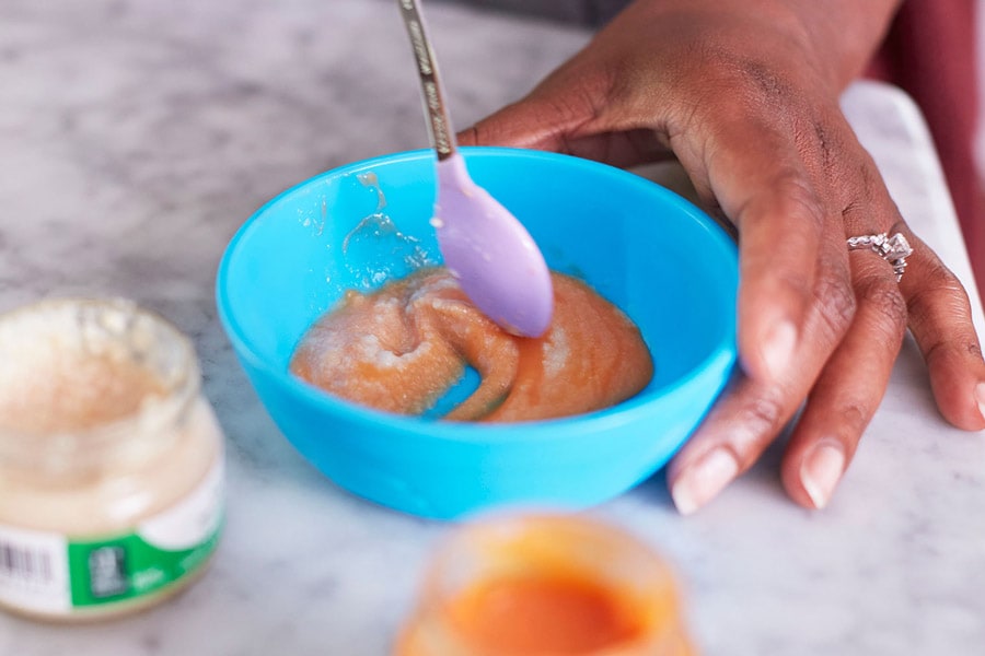 mom mixing purees in bowl