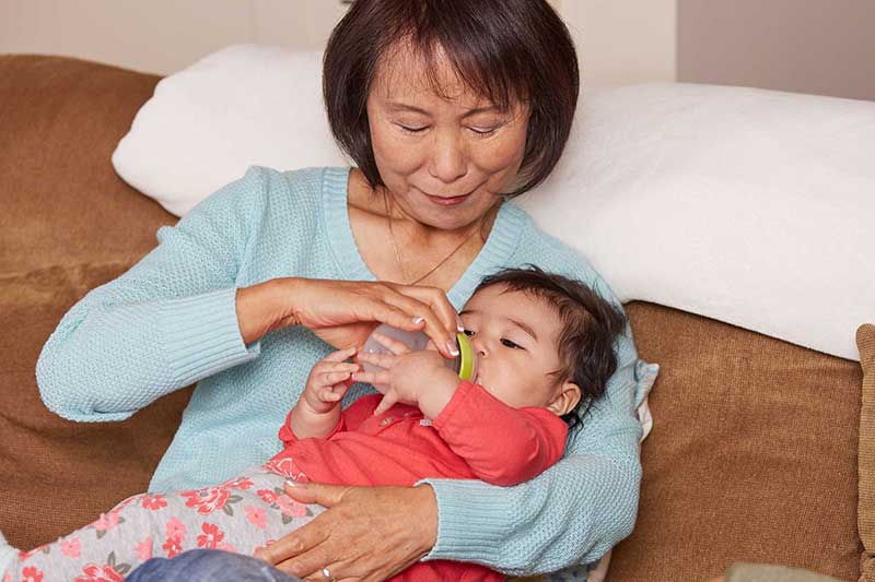 grandma feeding baby