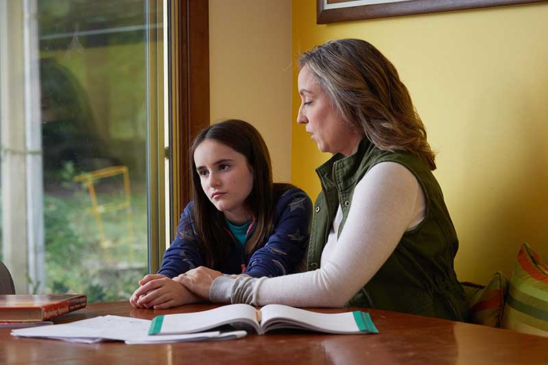 mom having difficult conversation with daughter