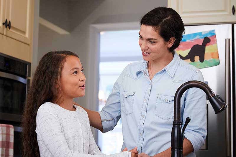 mother having serious conversation with daughter