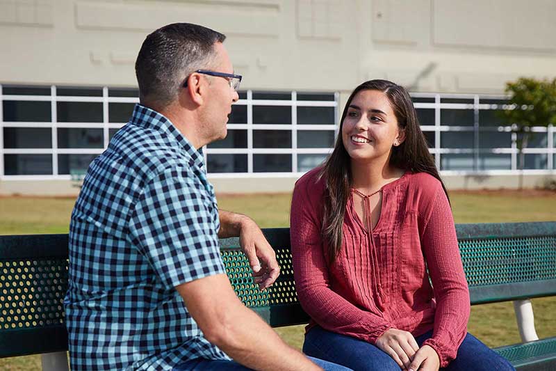 dad talking to daughter