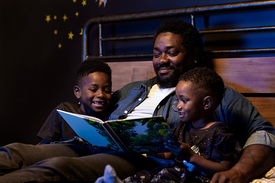 Dad reads a book to his sons
