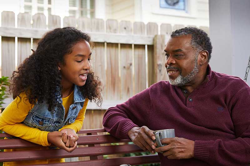 grandfather listening to his granddaughter