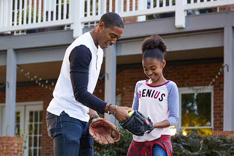 dad and daughter playing catch