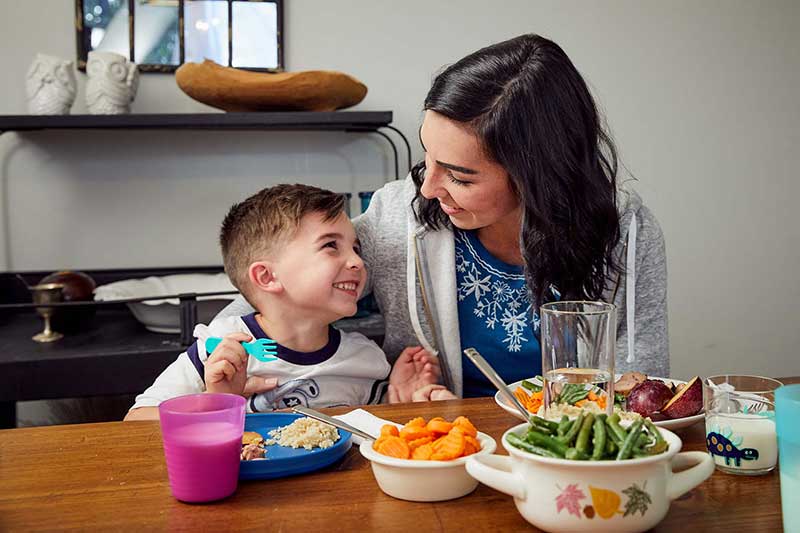 mom and son eating dinner