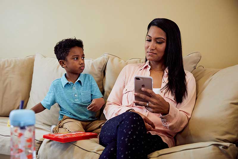 mom on phone with preschool wanting attention