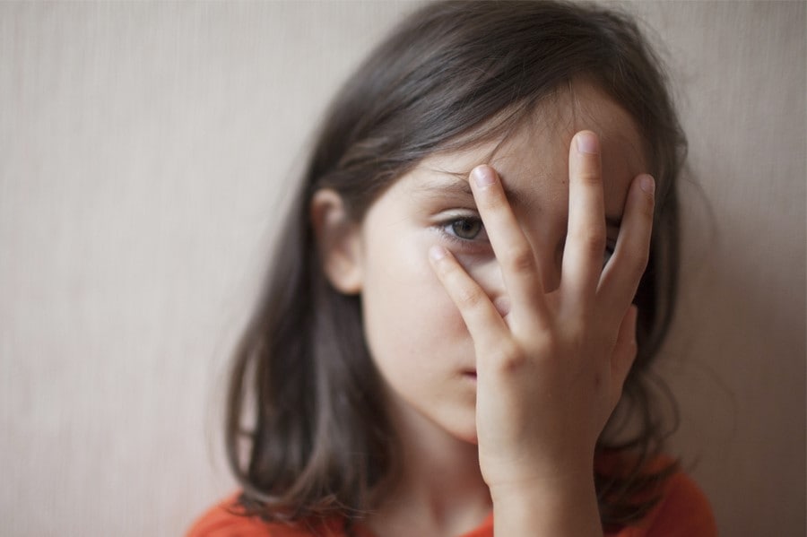 girl covering her face