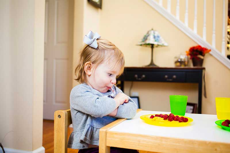 girl refusing fruit