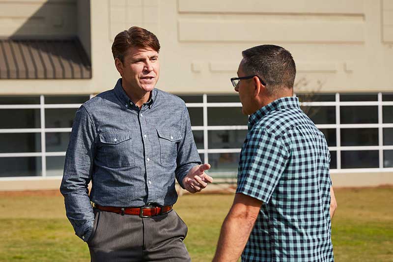 dad speaking to teacher after school