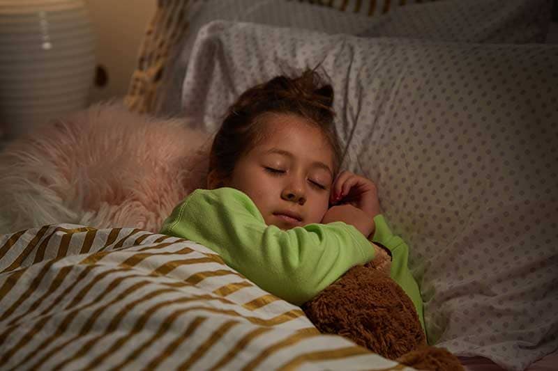 girl going to bed early before first day of school