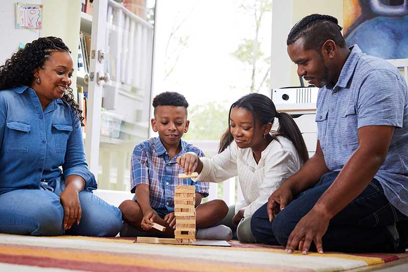 family playing jenga