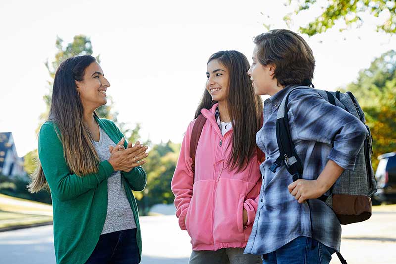 mom walking kids to school