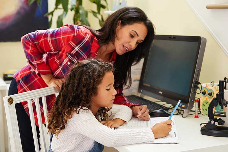 daughter studying for test with mom's help