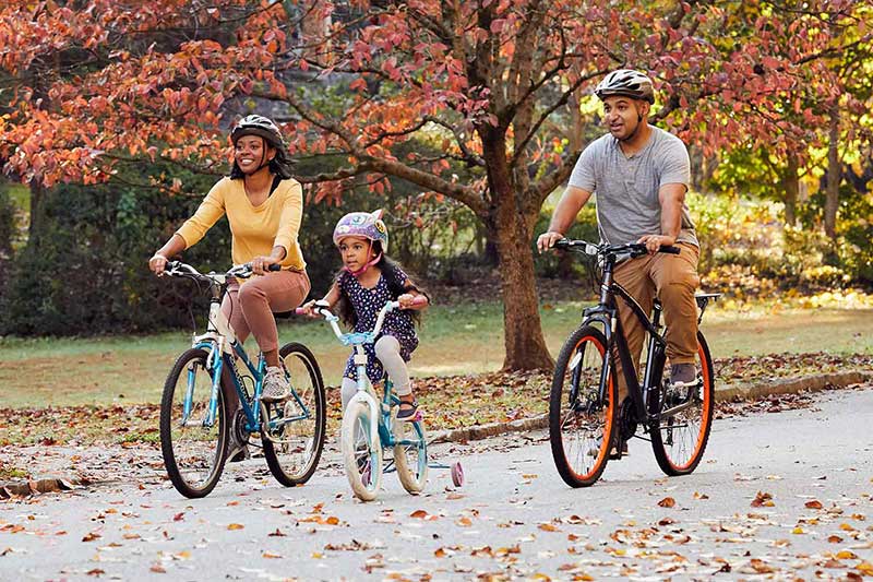 family riding bikes together
