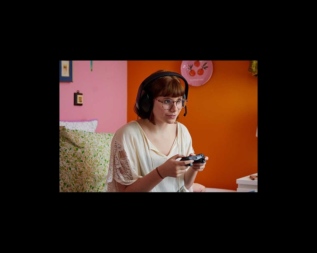 teen girl playing video game