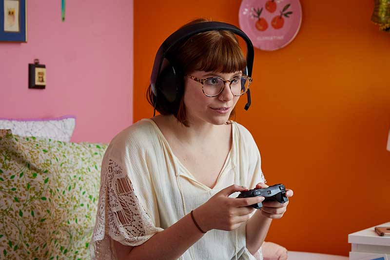 teen girl playing video game