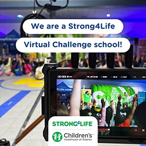 "We are a Strong4Life Virtual Challenge school!" with Challenge Team videoshoot in the background