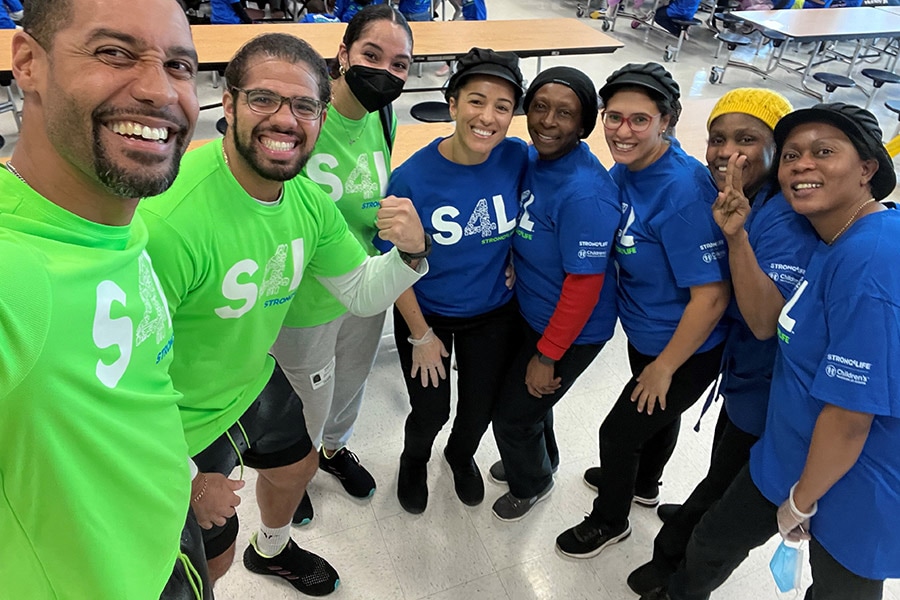 Strong4Life Challenge Team posing with school nutrition staff at follow-up visit