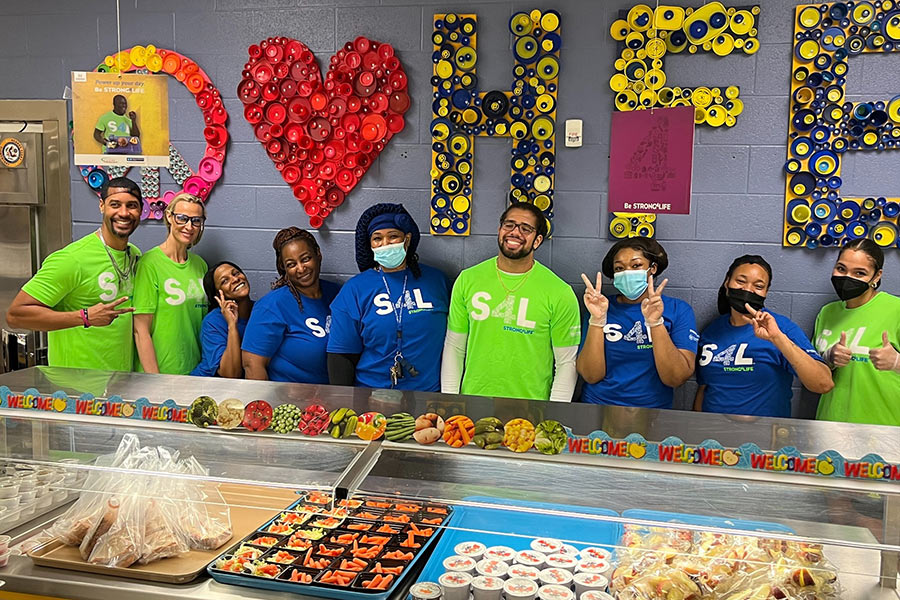The Strong4Life Challenge Team posing with school nutrition staff at spring follow-up visit