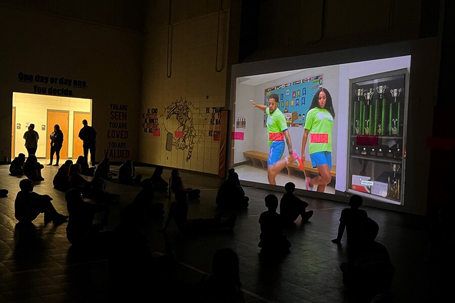 Georgia elementary school students watching a Challenge virtual visit video in the gym