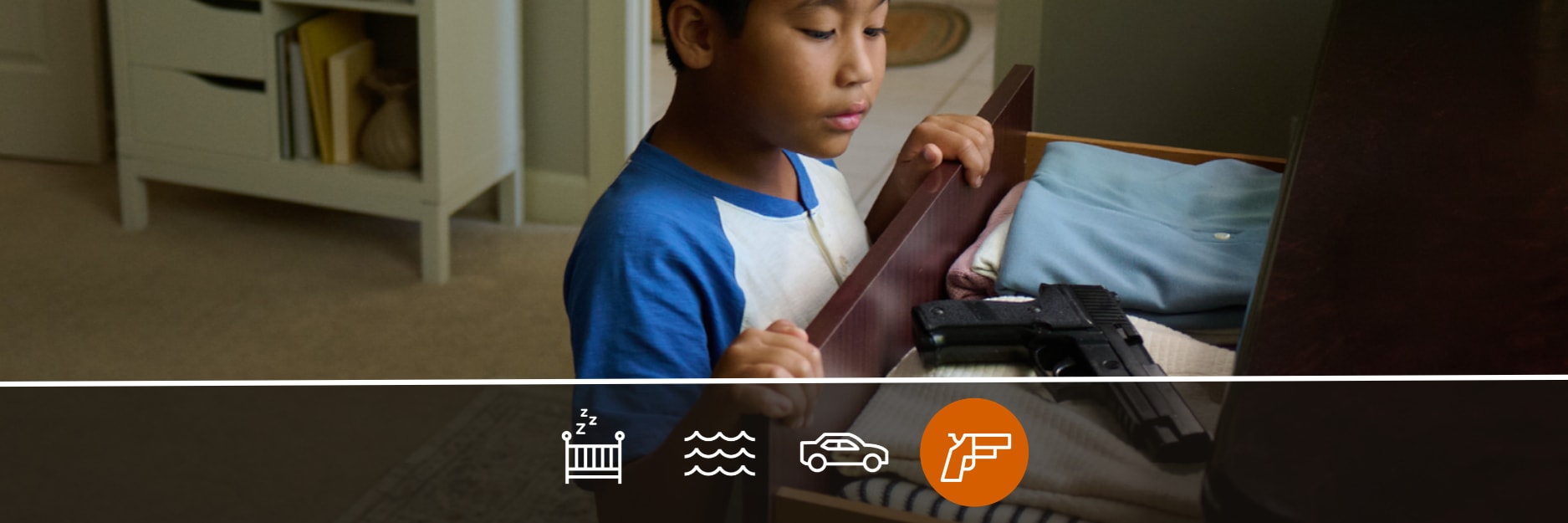 Image of young boy finding a gun in a drawer in a home, looking curious