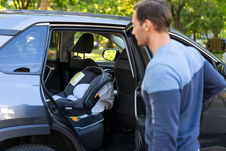 Father checks back seat to make sure child is not in car