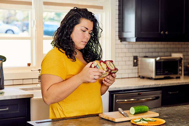 mom checking food labels for allergens