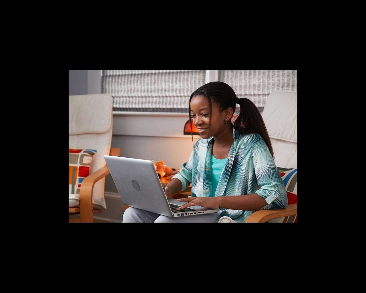 young girl using laptop