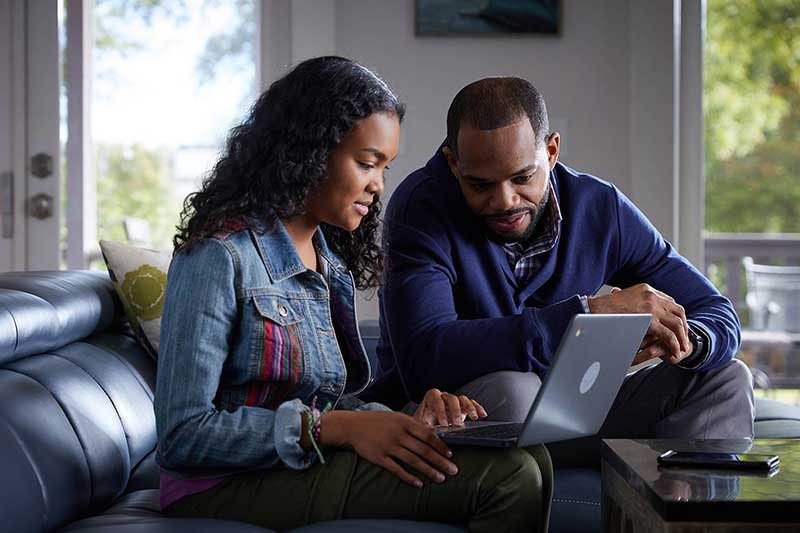 dad talking with teen about online safety