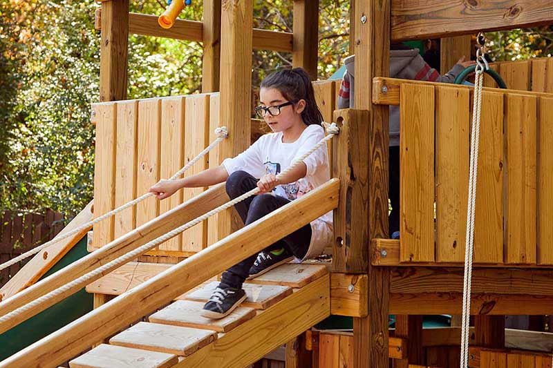 school age girl on playground