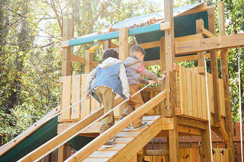 two school aged boys on playground