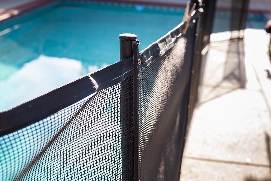 An image showing a pool fence used as a layer of drowning prevention.