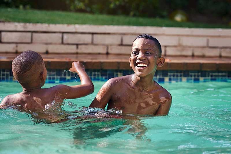 brothers playing in the pool