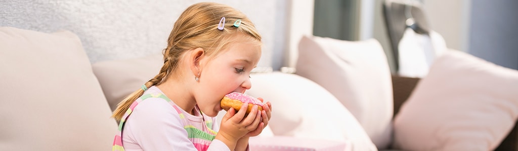 girl eating doughnut