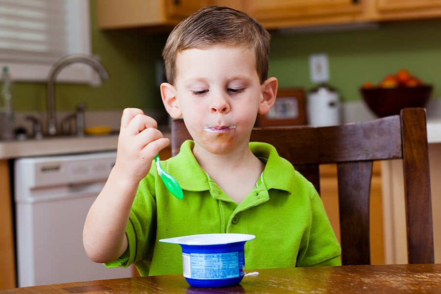 toddler enjoying yogurt