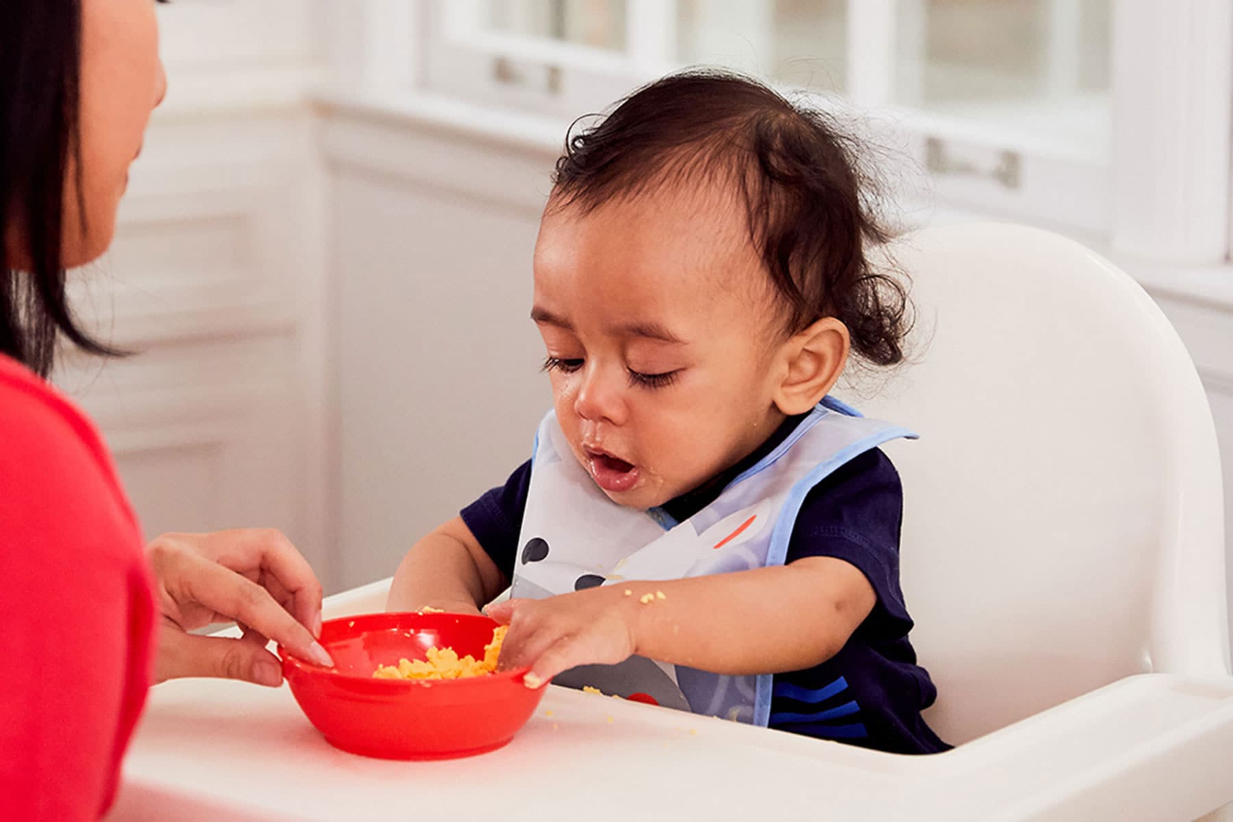 8 month old reaching for scrambled eggs