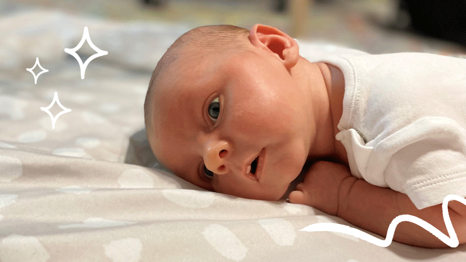 Newborn baby safely showing when to start tummy time