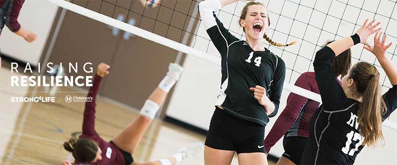 Teenage girl demonstrating resilience as she celebrates winning a volleyball game