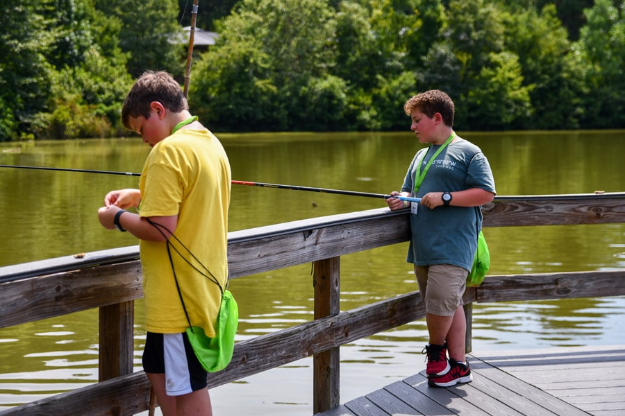 boys fishing and practicing social distancing